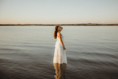 lake-senior-in-white-dress-water