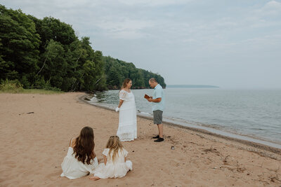 bride and groom saying vows on oak island the apostle islands