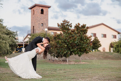 Bride and groom celebrate at the Big Sky Barn wedding venue in Montgomery, Texas.