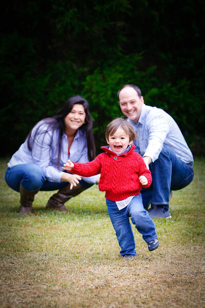 Husband and wife with toddler son, family portraits by Tamma Smith