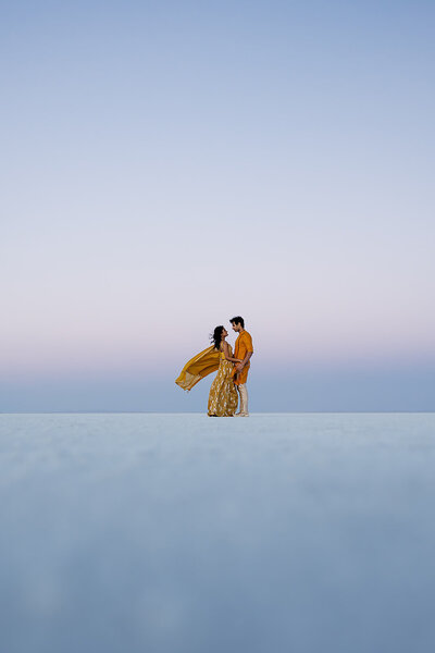 bride and groom in bright yellow elope the salt flats