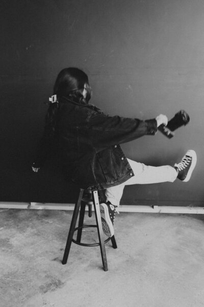 woman sitting on stool