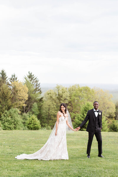 Bride and groom in field at Colorado wedding