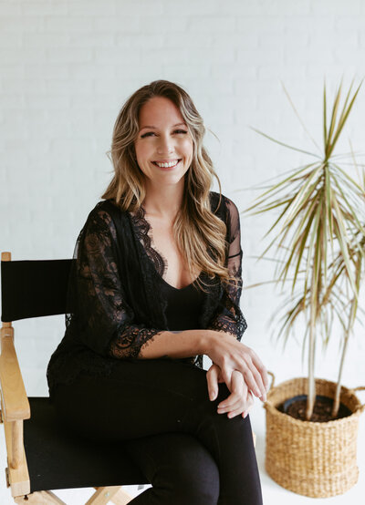 woman sitting in rattan chair