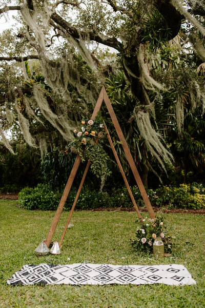 A frame arch with intentional florals.