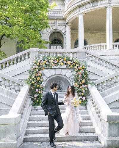 Bride and groom walking down steps