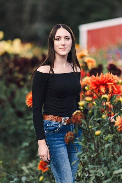A girl in a field of flowers at Ankely Family Farm