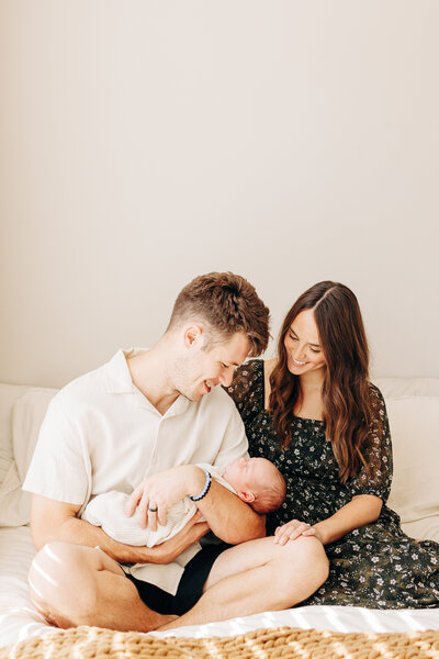 family of three during a in home newborn session in Houston, TX