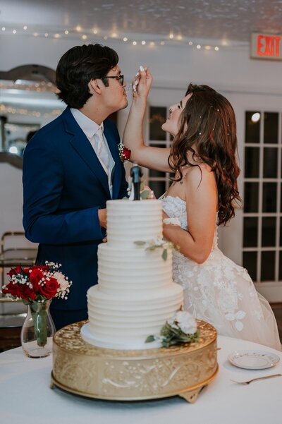 Destination wedding photographers captures bride and groom popping champagne