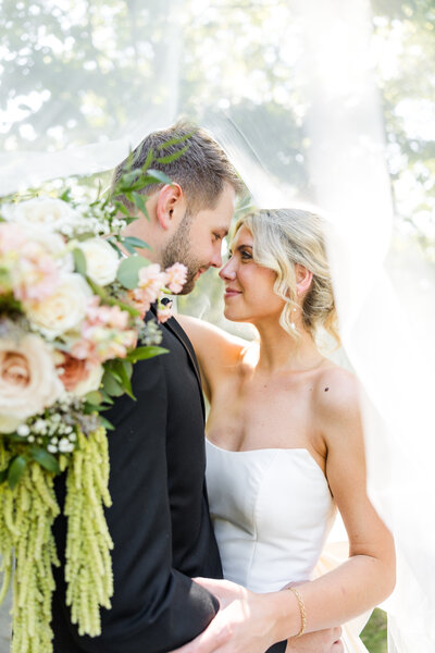 groom kissing bride's cheek