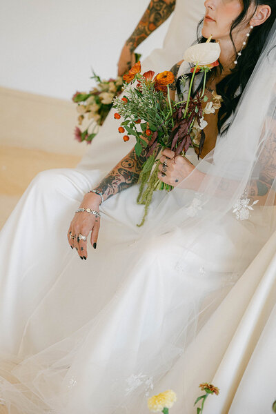 Bride's portrait captured on the porch of a house.