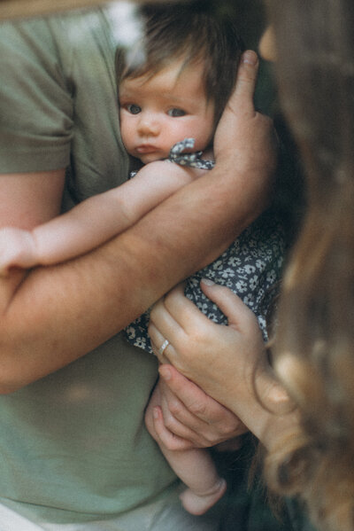 baby is looking at the camera through the glass in a Scottsdale home