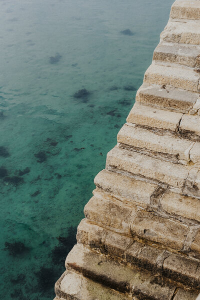 couple kissing and eloping on a mountain in the french alps