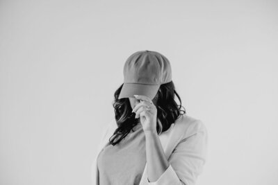 Online business owner holding phone, ready to scale with strategic marketing systems and consistent content