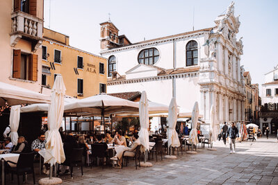 A restaurant spot with people eating outside in Italy