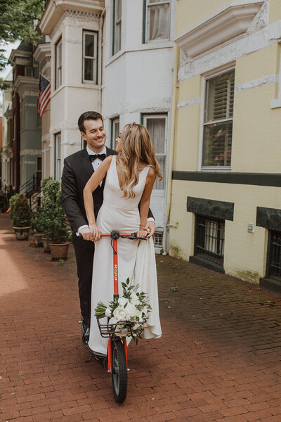 Bride and Groom share scooter ride