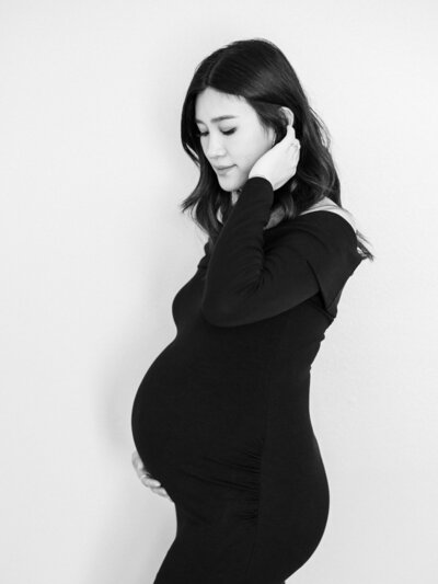 Stylish black and white portrait of pregnant woman