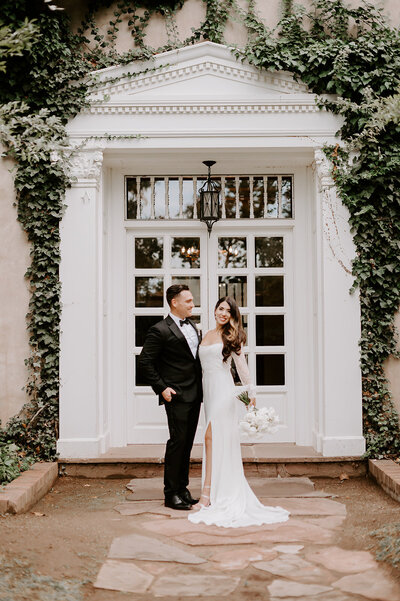 groom smiling and bride