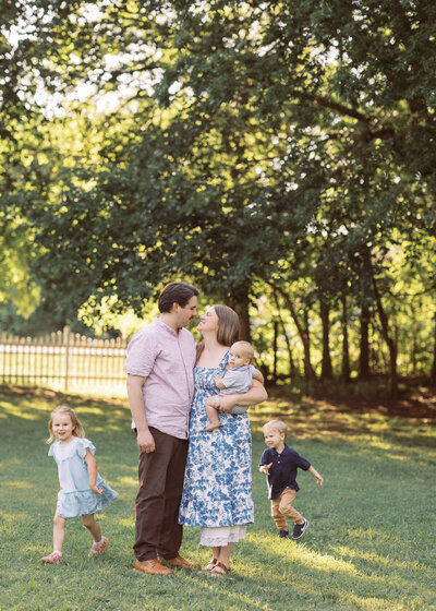 toddlers run around tulsa family photographer for family session at the victorian venue in broken arrow