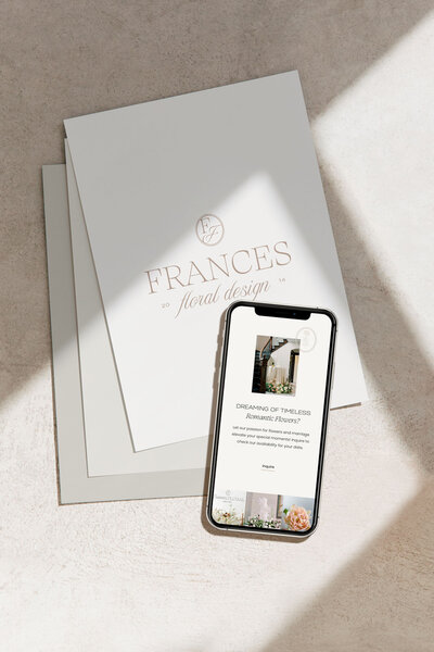Iphone with mockup of showit web design for luxury photographers, Palme Design Co