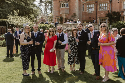 wedding guests smiling in the sunshine