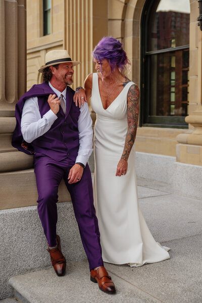 purple hair with purple suit wedding couple