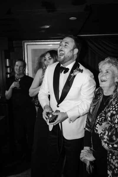 photo of bride looking at groom during speeches on wedding day
