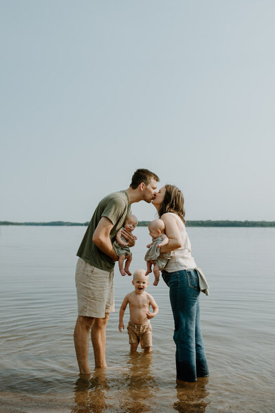 Couple kissing after a food fight.