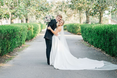 Bride and Groom Hugging with a glowy light and airy background