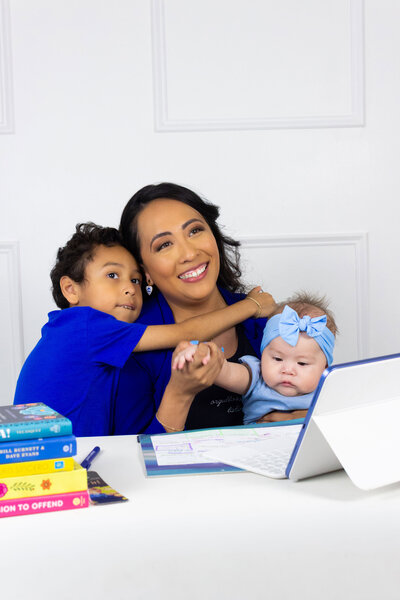 Latina bilingual coach balancing career and motherhood in a professional office, helping first-gen professionals grow in their industry, HR Mami Career Coaching.