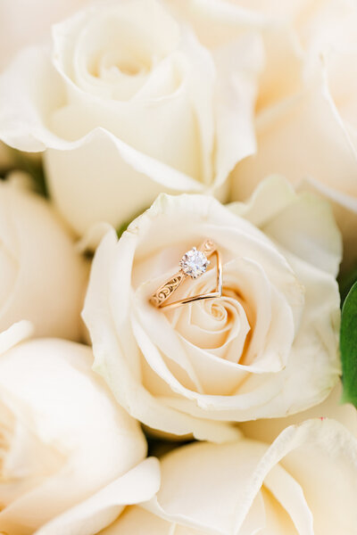 Diamond set engagement ring with white roses