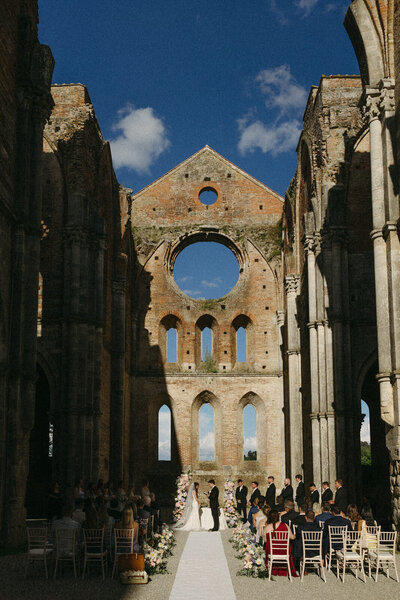 Breathtaking ceremony in Tuscany Italy at Abbey of San Galgano, by Andrea-Marie Photography