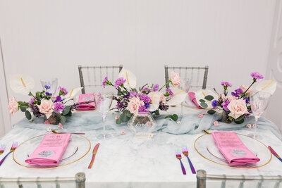 Colourful and contemporary reception table, purple and pink wedding decor, designed by Our Jonrah Events, wedding planner in Edmonton, Alberta, featured on the Brontë Bride Vendor Guide.