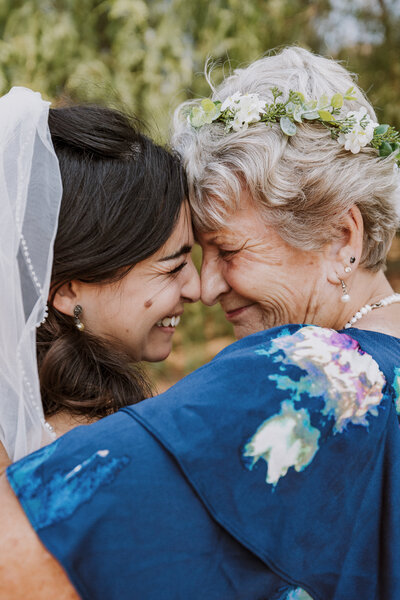 Emotional candid of bride with her grandmother on the wedding day.  Nostalgic moments.