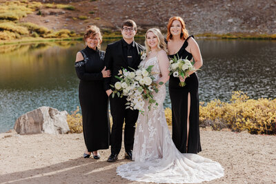 Bride and groom take family photos before Colorado wedding ceremony.