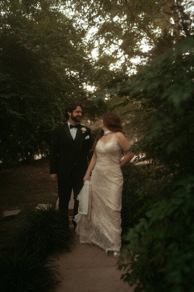 LGBTQ couple lean in for a kiss at their engagement session in Ocean Springs, Mississippi.