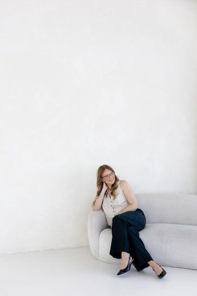 Suzy Goodrick poses for headshot in photo studio