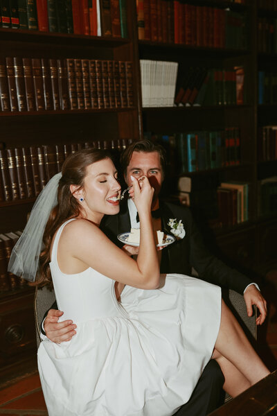 bride and groom eating cake