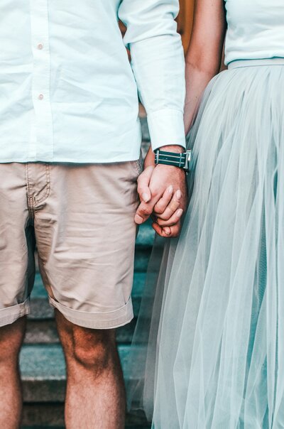 Man and a woman holding hands