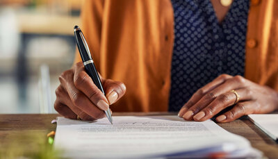 Business owner completing trademark application form