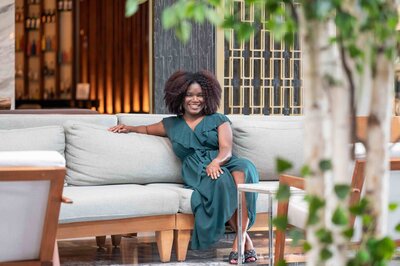 Nigerian wedding couple smiles amongst tropical plants
