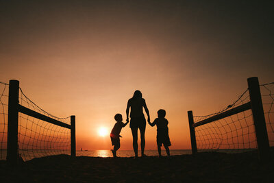 Family walking at sunset