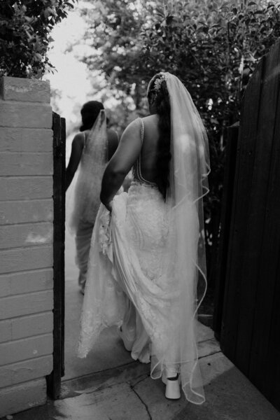 brides walking to reception at monserate winery in temecula