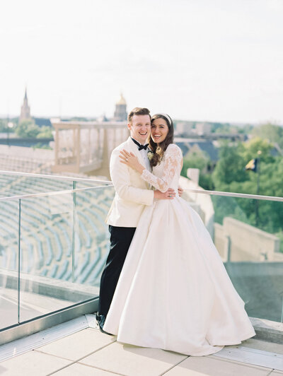 Bride and groom happily embracing in Arielle Peters' Photography Portfolio