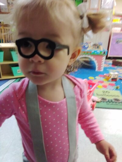 Young Girl with Dress Up Glasses CPC Albuquerque Childcare
