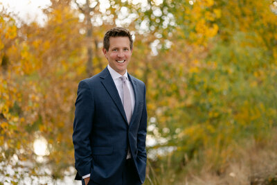 An employee of First National Bank of Omaha smiles confidently for the camera in Loveland, Colorado.