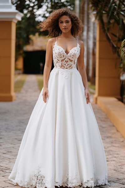 Elegant beadwork tops the bodice of this strapless fit and flare gown.