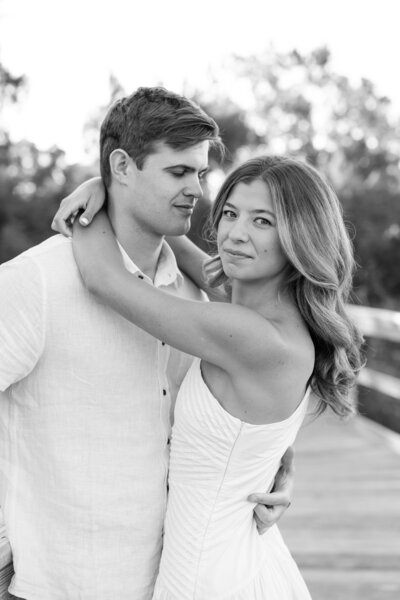 couple sitting on oak tree at hampton park charleston