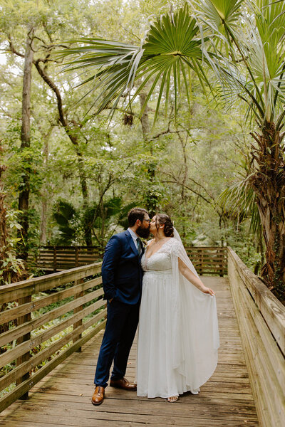 bride and groom holding hands