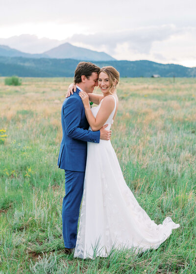 Bride and Groom snuggling after getting married in the mountains by virginia wedding photographer